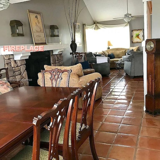 1350 S Fieldlark Ln, Homestead, FL 33035 - dining area with tile patterned flooring, ceiling fan, and a stone fireplace