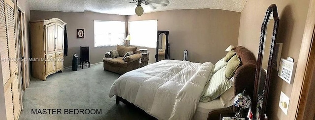 1350 S Fieldlark Ln, Homestead, FL 33035 - carpeted bedroom featuring a textured ceiling, vaulted ceiling, baseboards, and a ceiling fan