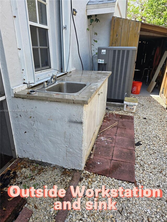 1350 S Fieldlark Ln, Homestead, FL 33035 - view of patio / terrace with central AC unit and a sink