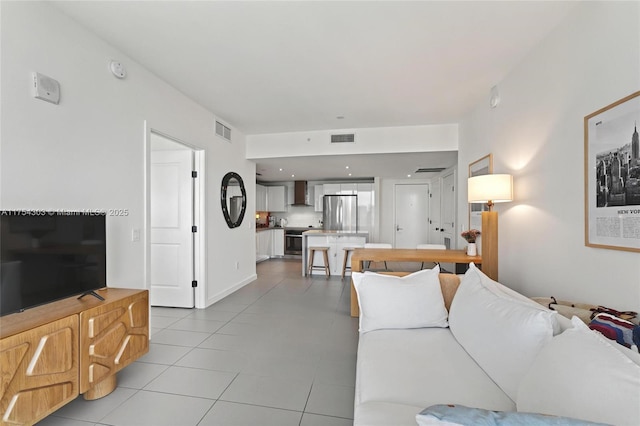 living room with visible vents and light tile patterned flooring