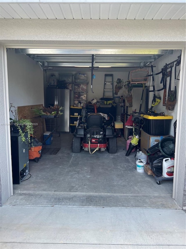 garage with freestanding refrigerator