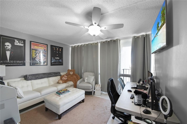 office space with ceiling fan and a textured ceiling