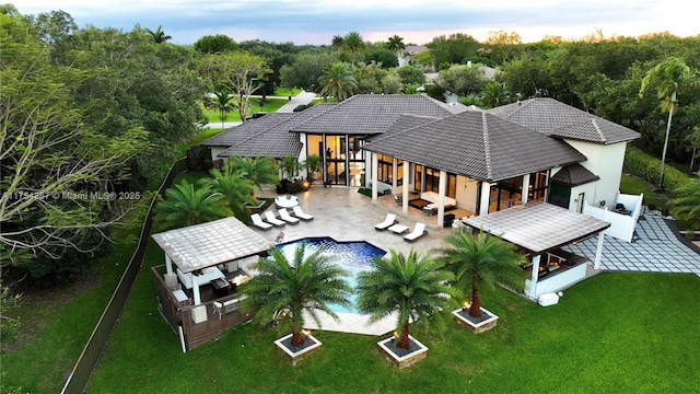 2980 Windmill Ranch Rd, Weston, FL 33331 - rear view of house featuring an outdoor living space, stucco siding, a patio area, a tiled roof, and outdoor dining space