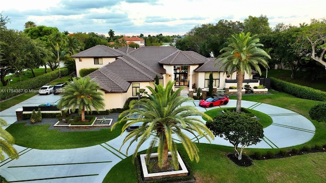 2980 Windmill Ranch Rd, Weston, FL 33331 - view of front of property featuring stucco siding, a front lawn, and a tiled roof