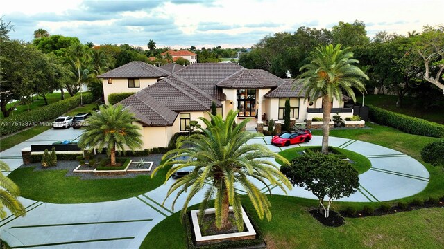 2980 Windmill Ranch Rd, Weston, FL 33331 - view of front of property with stucco siding, a front lawn, and a tiled roof