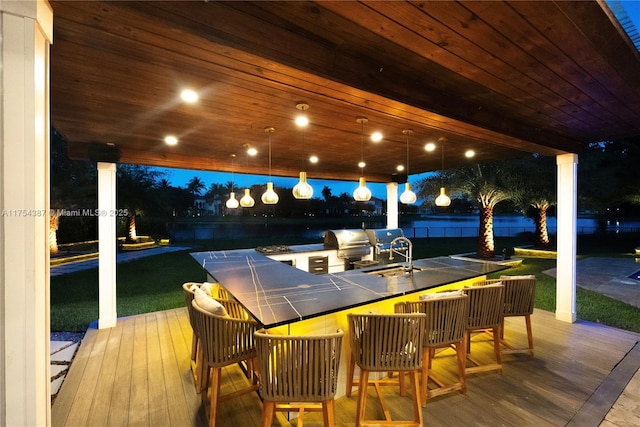 2980 Windmill Ranch Rd, Weston, FL 33331 - deck at night with an outdoor bar and grilling area