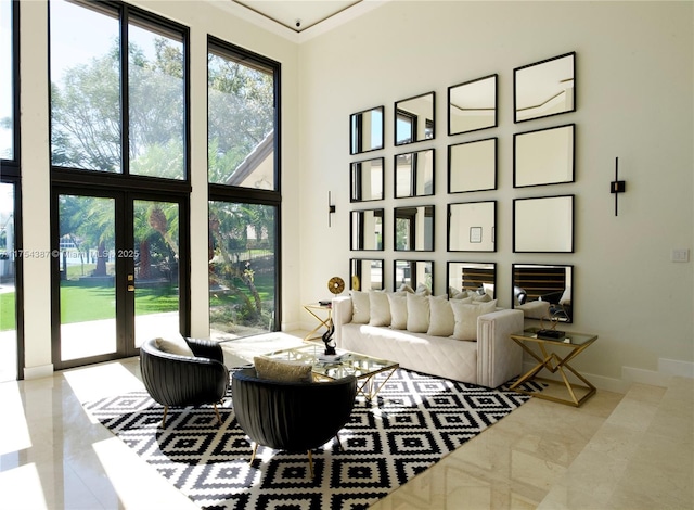 2980 Windmill Ranch Rd, Weston, FL 33331 - living area featuring a high ceiling, french doors, ornamental molding, baseboards, and tile patterned floors