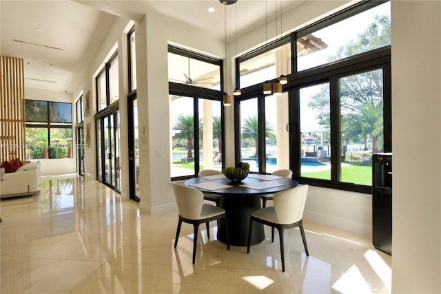 2980 Windmill Ranch Rd, Weston, FL 33331 - dining area featuring baseboards and a high ceiling