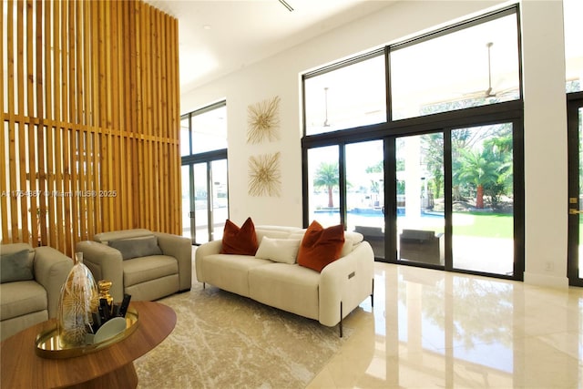 dining room with a towering ceiling