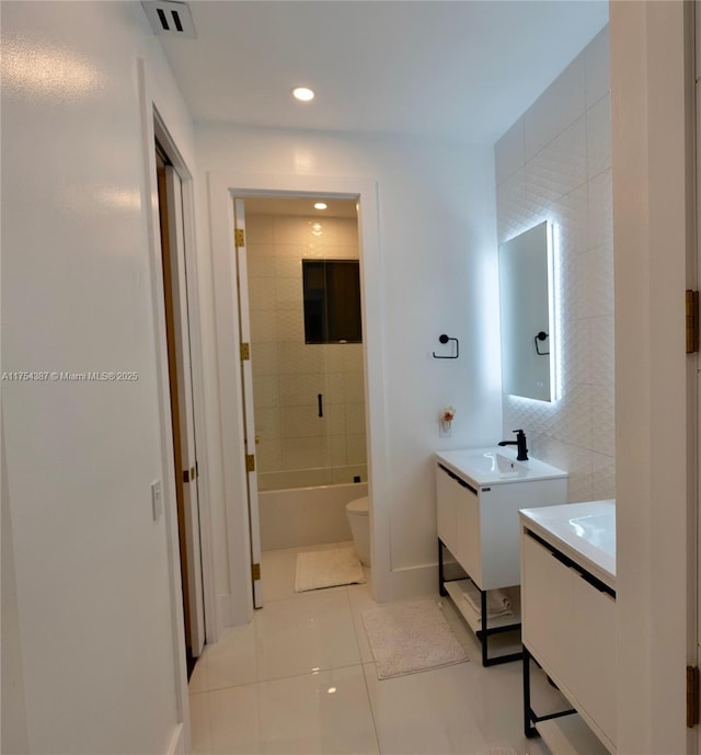 2980 Windmill Ranch Rd, Weston, FL 33331 - bathroom with tile patterned floors, two vanities, toilet, recessed lighting, and baseboards