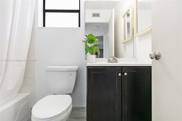 full bathroom featuring toilet, visible vents, and vanity