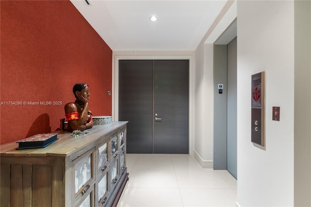 corridor featuring light tile patterned floors