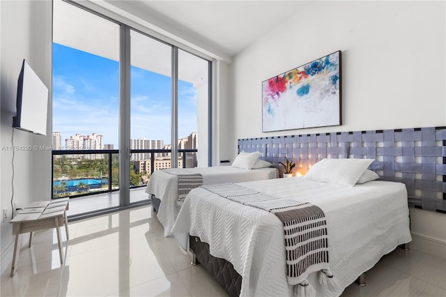 bedroom featuring tile patterned flooring, access to outside, and floor to ceiling windows