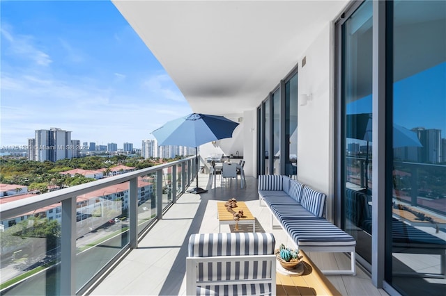 balcony featuring a city view and an outdoor hangout area