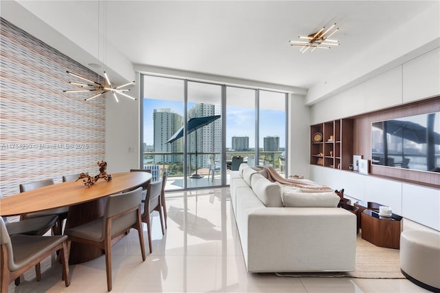 living room featuring an accent wall, floor to ceiling windows, a city view, and light tile patterned flooring