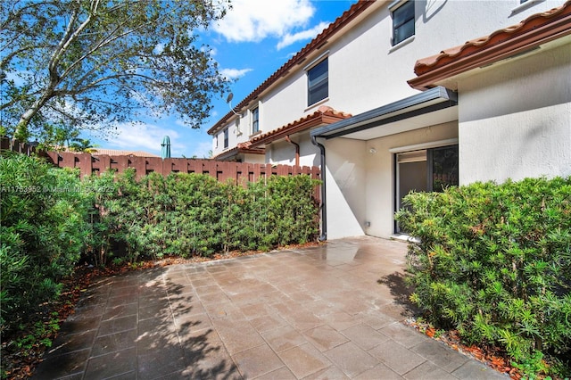 view of patio / terrace featuring fence