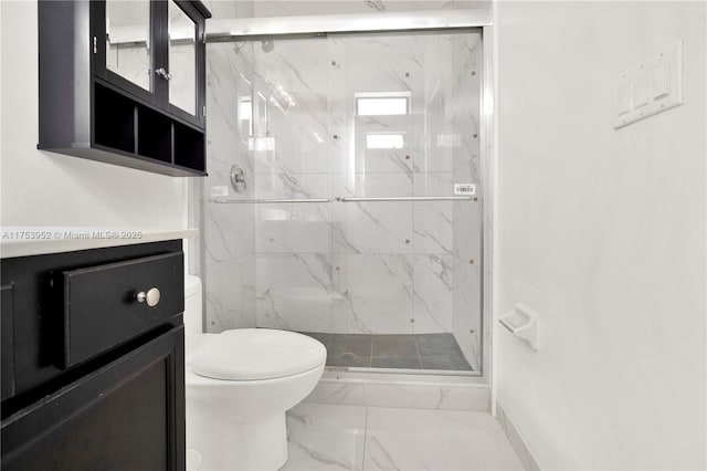 full bath with toilet, marble finish floor, a marble finish shower, and vanity