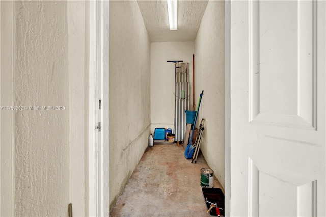 hall featuring concrete floors