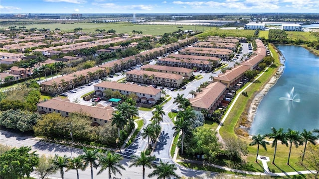 aerial view featuring a water view and a residential view