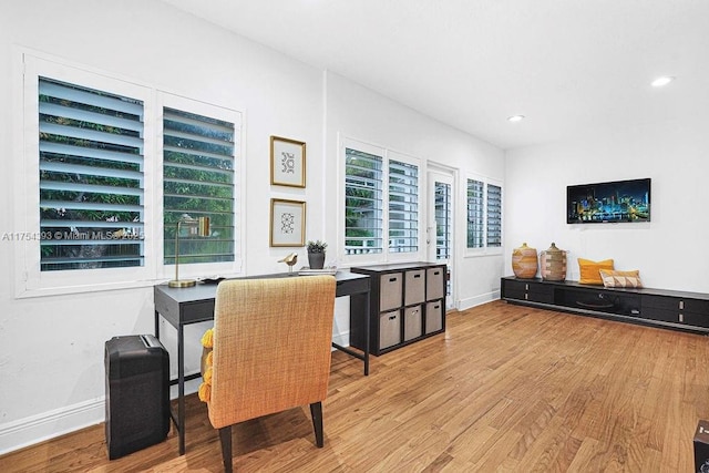 dining area with recessed lighting, wood finished floors, and baseboards