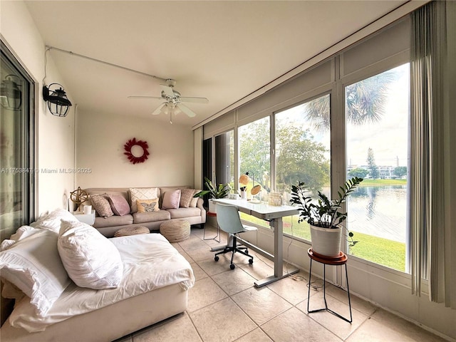 sunroom featuring ceiling fan