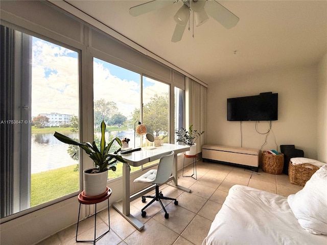 office featuring light tile patterned floors and a water view