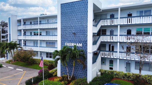 view of building exterior featuring uncovered parking