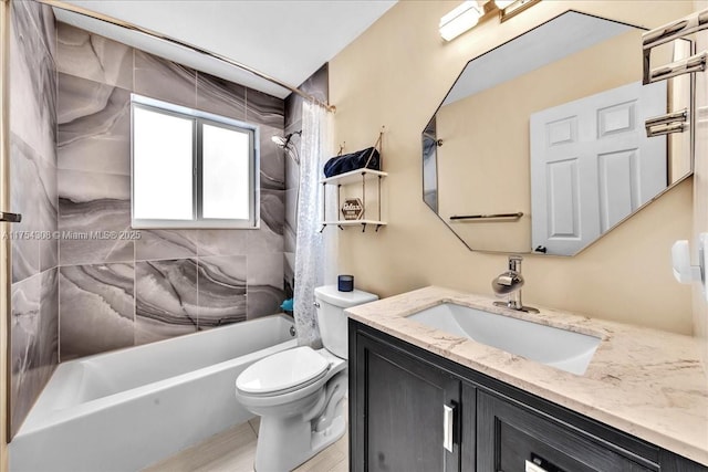 full bath featuring shower / bath combo, vanity, and toilet