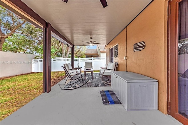 view of patio / terrace with ceiling fan and a fenced backyard