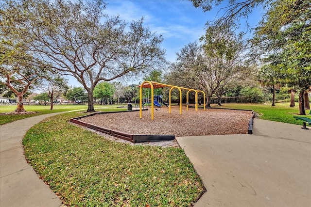 community play area with a lawn