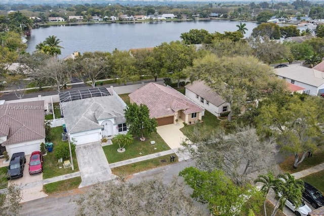 bird's eye view featuring a water view and a residential view