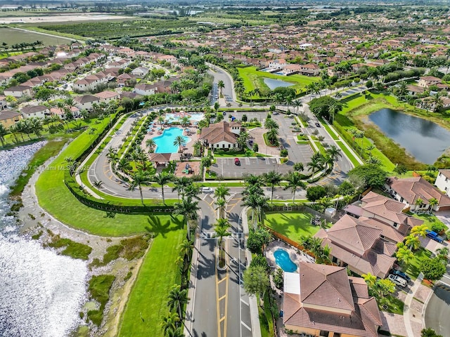 bird's eye view featuring a water view and a residential view