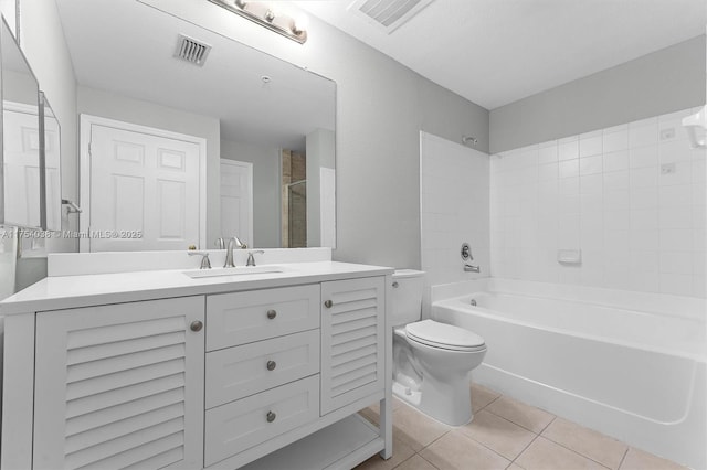 bathroom featuring tile patterned flooring, visible vents, vanity, and toilet