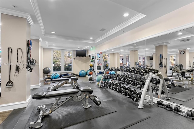 exercise room with baseboards, a raised ceiling, crown molding, and recessed lighting