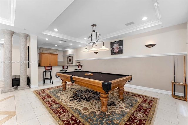 game room with ornate columns, a tray ceiling, and ornamental molding