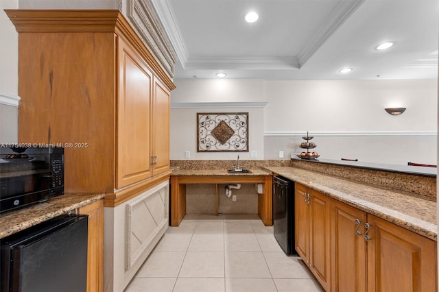 kitchen featuring crown molding, light tile patterned floors, a raised ceiling, light stone countertops, and black appliances