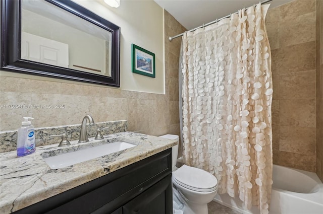 full bath featuring shower / bath combination with curtain, tile walls, toilet, and vanity