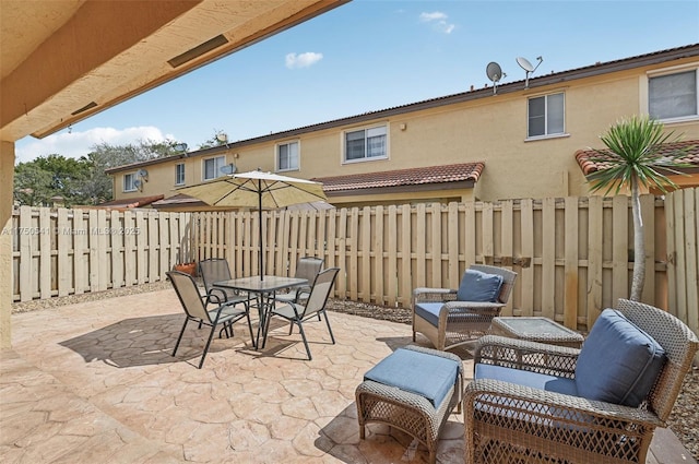 view of patio / terrace with outdoor dining area and a fenced backyard