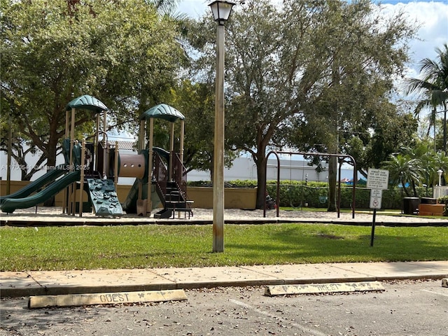 community play area with a lawn