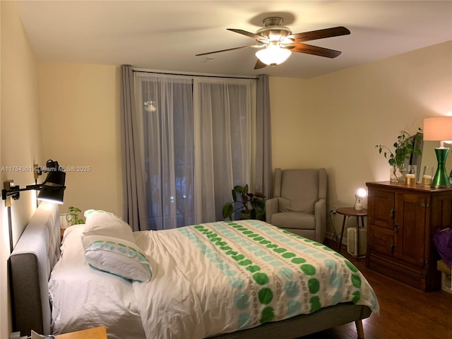 bedroom featuring wood finished floors and a ceiling fan