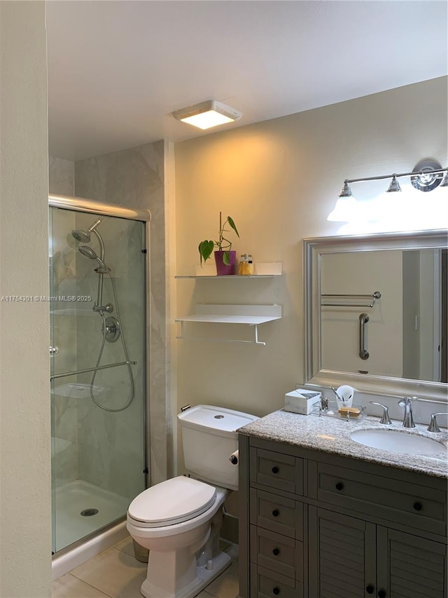 bathroom with toilet, a stall shower, tile patterned flooring, and vanity