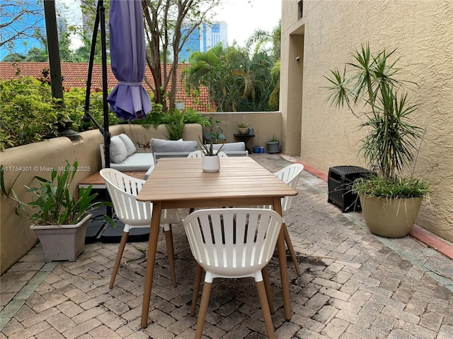 view of patio / terrace with outdoor lounge area and fence