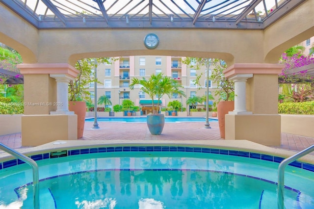 pool with a community hot tub