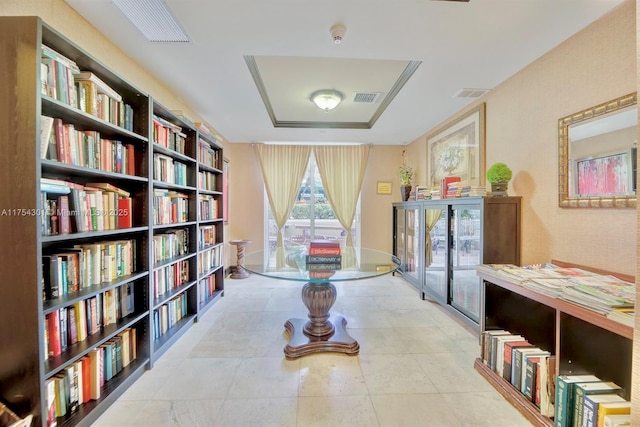 hallway with tile patterned flooring and visible vents