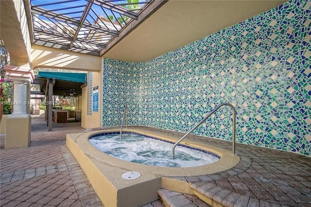 view of pool featuring a hot tub