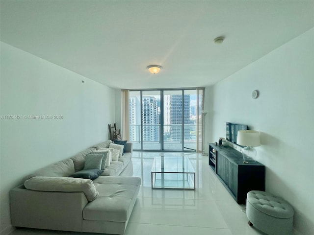 living area featuring light tile patterned floors and floor to ceiling windows