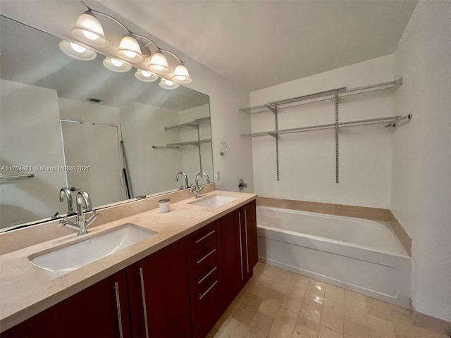 full bathroom featuring double vanity, a shower with door, a bath, and a sink