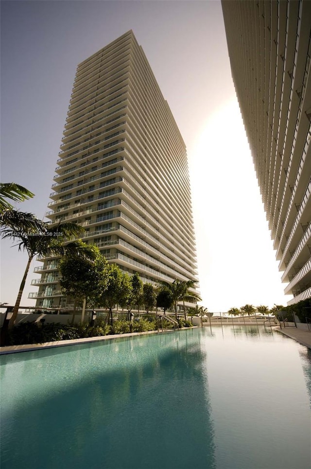 view of swimming pool with a water view