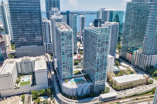 exterior space featuring a view of city and a water view