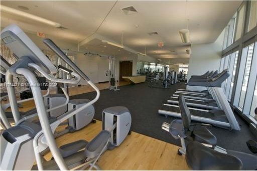 gym featuring visible vents and wood finished floors